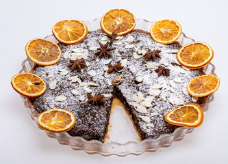 Tart with poppy seeds and fruit sprinkled with powdered sugar