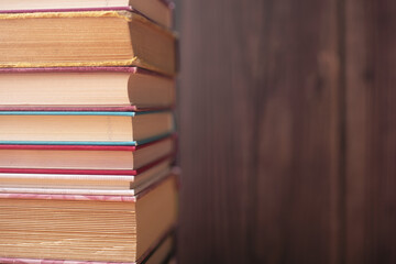 Pile of old books on the table. Wisdom of world hidden in the book. Learning. Education.