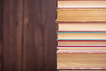 Pile of old books on the table. Wisdom of world hidden in the book. Learning. Education.