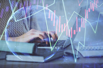 Double exposure of woman hands typing on computer and forex chart hologram drawing. Stock market analysis concept.