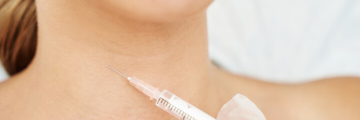 Neck injection at spa salon. Doctor hands. Closeup view. Pretty female patient. Beauty treatment....