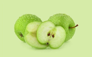 green apple with drop of water isolated on green background.