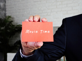 Business concept meaning Movie Time 8 with phrase on the piece of paper.