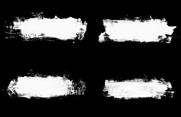set white strokes of paint isolated on a black background. design brush