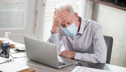 Stressed businessman; concept of economic crisis due to the coronavirus outbreak