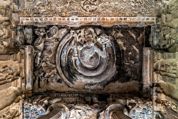Exquisite stone carved artifacts on ceiling of goddess Durga temple in Aihole.
