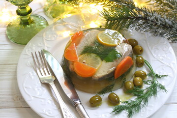 Jellied sturgeon with lemon, olives and glasses of white wine
