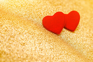 Heart symbol on a gold shiny background

