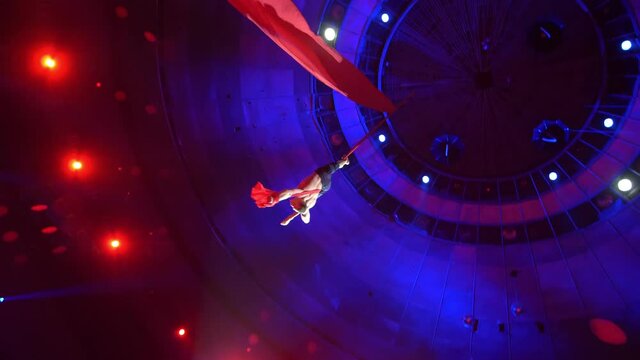 Aerialist on canvases in circus