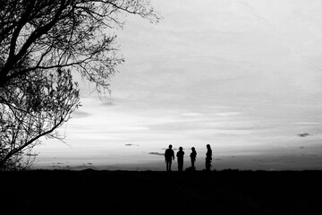 Silhouettes of soldiers on a hill