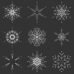 Naklejka na ściany i meble Vector collection of artistic icy abstract crystal snow flakes isolated on background as winter december decoration group or collection. Ice or frost beautiful star ornament silhouette or season art