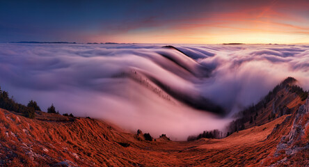 Sunset in the autumn mountains above the clouds during the weather inversion Fatra mountains in...