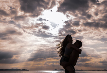 Fototapeta premium Lovers were walking happily on the beach, Romantic moment of Man And Woman In Love