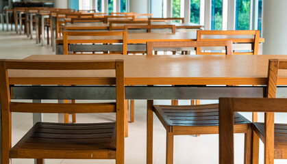 Empty tables and chairs in a restaurant