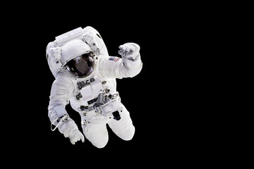 Astronaut with a jetpack isolated on black background with copy space -  Elements of this image are...