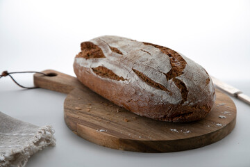 
Fresh rye bread on a wooden cutting board