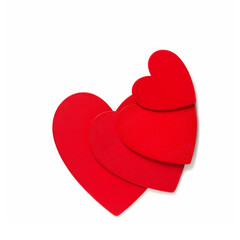 Love symbol decoration, concept of Valentine day, red painted hearts lying in a stack on white