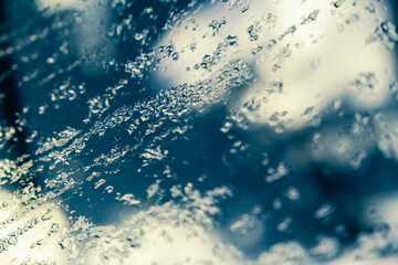 Water droplets on the car window glass on a winter morning.