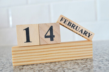 February 14, Cover design with number cube on a white background and granite table.