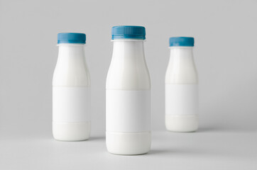 White plastic yogurt or milk bottle mockup with blank label.