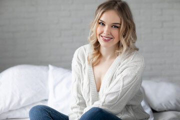 Portrait of a happy young woman at home