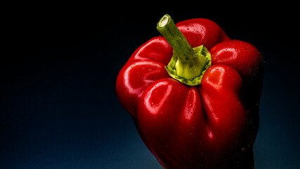 
bell pepper on a dark background on a glass matte table wallpaper size 16: 9 stock photo