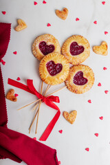 Small cherry pies pops on sticks on Valentine's Day. Place for text or advertising. Postcard