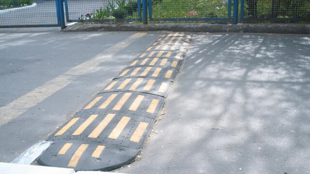 Truck driving over speed bump