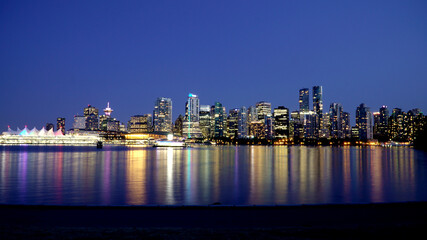 Vancouver skyline at night as seen from Stanley Park, British Columbia, Canada
