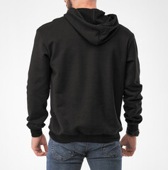 man wears black hoodie. isolated clothing mockup photo
