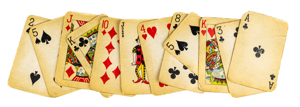 old dirty playing cards on a white background