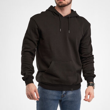 Man Wears Black Hoodie. Isolated Clothing Mockup Photo