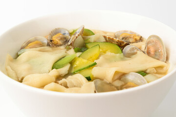 Cooking clam flour broth on a white background