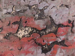 Cracks on a old scratched grunge concrete red floor texture wallpaper