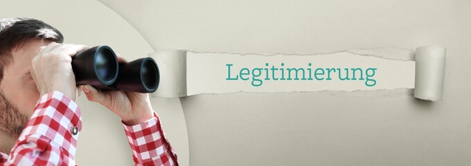 Legitimierung. Mann (Anwalt) bei Beobachtung mit Fernglas. Fokus auf Wort/Text in einem Papier Riss.
