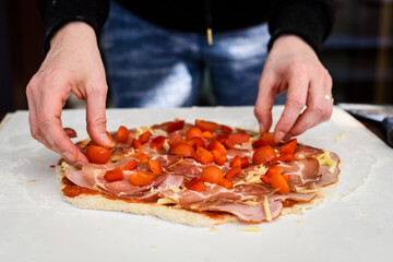 Making of homemade Italian pizza in fireplace brick oven.