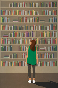 Curious woman standing at towering bookshelf
