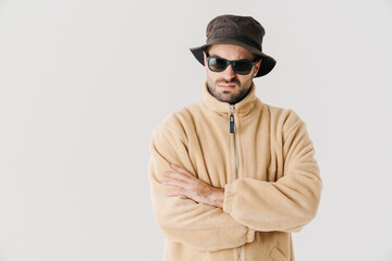 Portrait of an upset young man wearing beige jacket
