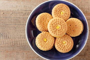 Sunny Cookies Durian Cream in Blue Plate on Wood Background