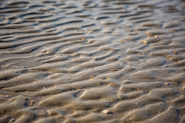 Hintergrund - Textur Wellenmuster an einem Sandstrand