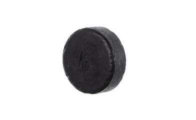 old hockey puck isolated on white background