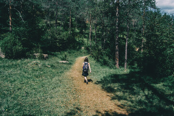 woman walking along a small path