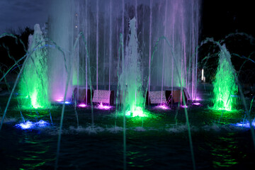 City fountain at night. Selective focus with shallow depth of field.