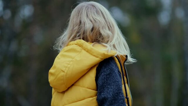 portrait of smiling little girl running and jumping in park. Happy child in the park. Slow motion video. stock footage