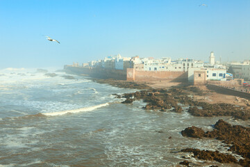 Scenic view of the old medina of Essaouira in sunny foggy morning, along the Atlantic, Morocco.