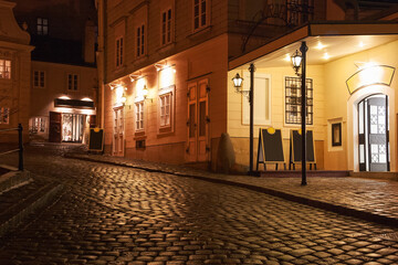Illuminated cobbled street by late  evening ,Vienna , Austria.