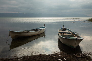 Naklejka premium fishing boats on the calm waters of Lake Iznik