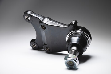 off-road Ball joint car suspension on a gray background. New spare parts axel car elements