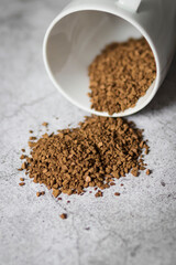 Instant coffee with white cup on gray background