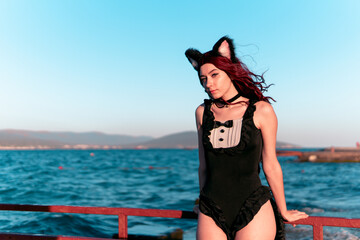 
Cat girl in a swimsuit at the sea